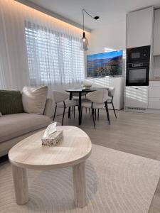 a living room with a couch and a table at Rezidence Sadová Zlín in Zlín