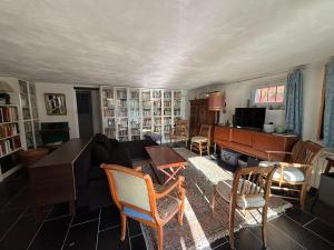 a living room with a couch and a piano at Chez Zabou in Carpentras