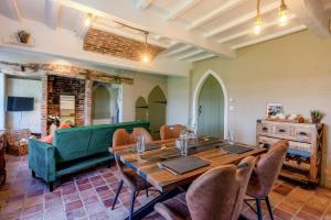 a living room with a table and a green couch at 1 Bed in Linton oc-s31746 in Linton