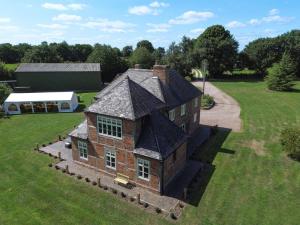 an aerial view of a large brick house in a field at 1 Bed in Linton oc-s31746 in Linton