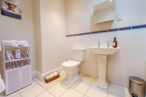 a bathroom with a toilet and a sink at 1 Bed in Linton oc-s31746 in Linton +15 photos