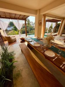 a dining room with a table in a room at Luxury Ocean View Villa in Brisas de Zicatela