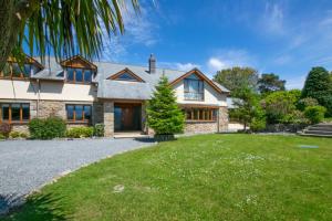 an exterior view of a house with a yard at 7 Bed in Ashton oc-p00891 in Germoe