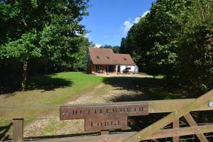 a house on a hill with a sign in front of it at 3 Bed in Thursford oc-2370 in Thursford
