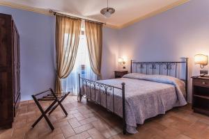 a bedroom with a bed and a window at Il Pianaccio in Spoleto