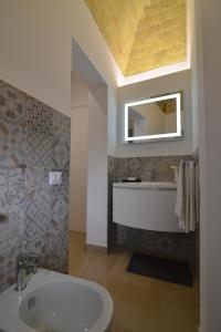 Ein Badezimmer in der Unterkunft L'Affaccio Dell'Abate