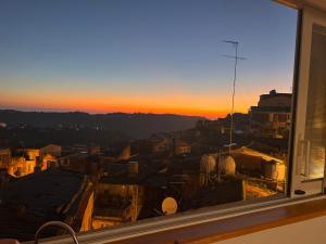 a view from a window of a city at sunset at il ficodindia appartament in Caltagirone