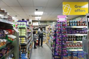 a man and a child in a store aisle at Weymouth Bay Holiday Static Caravan in Preston