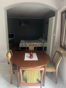 a dining room with a table and chairs at Nesa Beach Front Apartment in Poreč