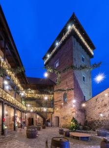 a large building with lights on it at night at OLD TOWN ROAD in Karlovac