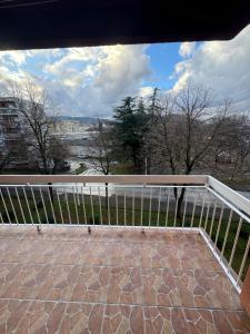 a balcony with a view of the water at Apartman Jojo in Čapljina
