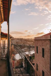 a view of a bridge over a river from a building at LENSCAPE Coterie in Porto