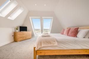 a bedroom with a large bed and a window at 3 Bed in Tintagel oc-e32938 in Tintagel