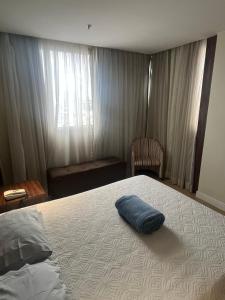 En eller flere senge i et værelse på Flat em Taguatinga