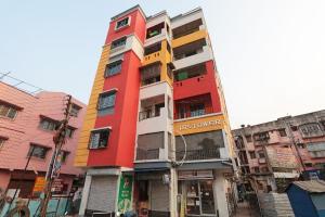 a tall building with many colors on it at Star Hospitality in kolkata