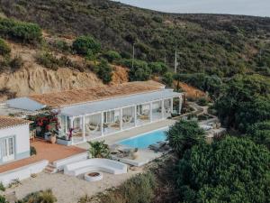 an aerial view of a house with a swimming pool at Herdade d' Amoreira Lavanda Villa in Aljezur