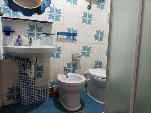 a bathroom with a sink and a toilet at Affitto breve Puccio A Chiazza Realmonte in Realmonte +54 photos