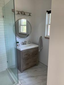 a bathroom with a sink and a mirror at Sautee Nacoochee Studio near Helen in Sautee Nacoochee +6 photos