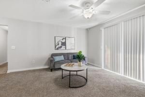 a living room with a couch and a ceiling fan at Comfortable 2BR2BA with Modern Touches in Jackson