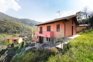 a house on the side of a hill at villa between lake and mountains in Valbrona