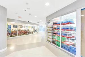 an empty aisle in a store with bikes on shelves at Castle B6 in Miami Beach +29 photos