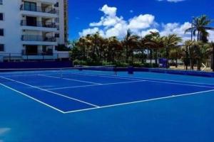 a tennis court in front of a building at Castle B6 in Miami Beach