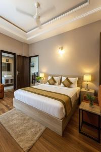Giường trong phòng chung tại Hotel Citrine, Vrindavan-A Four Star Luxury Retreat # By Nandan Group #