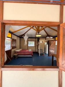 a room with a bed inside of a house at Cabana Candeia in Palmeiras