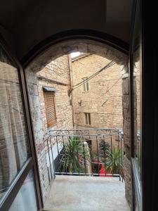 a view of a balcony from a window at Vicolo San rufino in Assisi