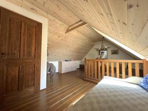 a bedroom with a bed and a wooden ceiling at Chalupa Za Vraty Jevišovice in Jevišovice +20 photos