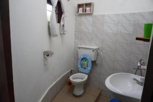 a bathroom with a toilet and a sink at SALEM Eco-Lodge & Guesthouse in Mbale +51 photos