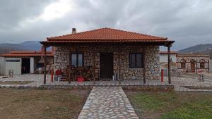 a small stone house with a brick at Leo Villas in Florina