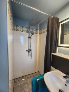 a bathroom with a sink and a shower at Pamir in Ferdinandshof
