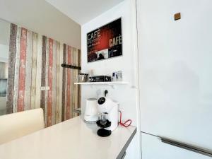 a kitchen counter with a coffee maker on it at Cannes Maria in Cannes +23 photos