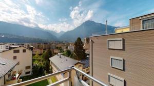 a view from a balcony of a city with mountains at Bijou in Mitten von Naters in Naters