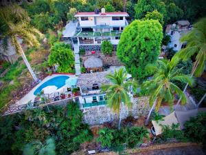 an aerial view of a house with a swimming pool at Casa Breizh - Adult Only in Acapulco +65 photos