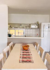 a kitchen with a table with a bowl on it at PUEBLO CHICO - casas de lago in Villa Ciudad de América
