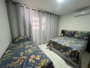 En eller flere senge i et værelse på Casa Flor de Liz