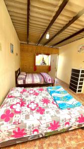 a bedroom with a large bed in a room at Arrullos del Mar in Zorritos