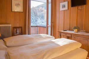 En eller flere senge i et værelse på Hotel Cristallo