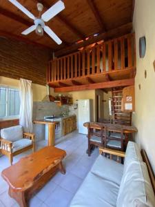 a living room with a couch and a table at Duplex lo de Aaron in El Bolsón