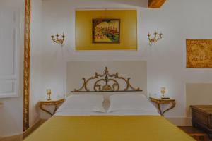 a bedroom with a large bed in a room at Arpinelli Suite in Rome