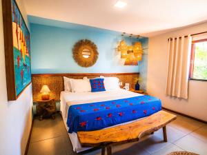 a bedroom with a bed with a blue wall at Pousada Vila Parnaíba in Parnaíba +83 photos