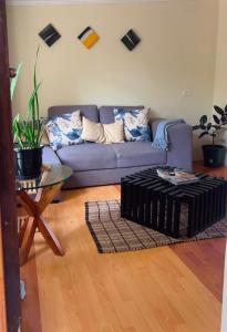 a living room with a couch and a table at Moya Guesthouse in Johannesburg