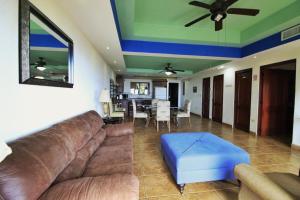 a living room with a couch and a table at Suite Esteli 114 Gran Pacifica Resort in San Diego