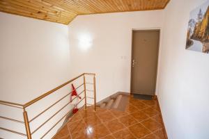a staircase in a room with a stair case at Biser Kupresa 2 in Kupres