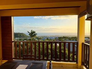 a balcony with a view of the ocean at Apartment with exceptional views, Saint-Joseph in Saint-Joseph