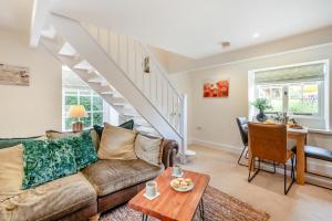 a living room with a couch and a table at 2 Bed in Heacham oc-2013 in Heacham +14 photos