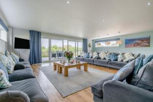 a living room with couches and a coffee table at 6 Bed in Winnards Perch oc-t29966 in Saint Columb Major