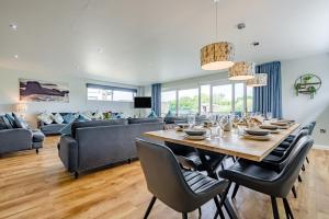 a dining room with a table and a couch at 6 Bed in Winnards Perch oc-t29966 in Saint Columb Major
